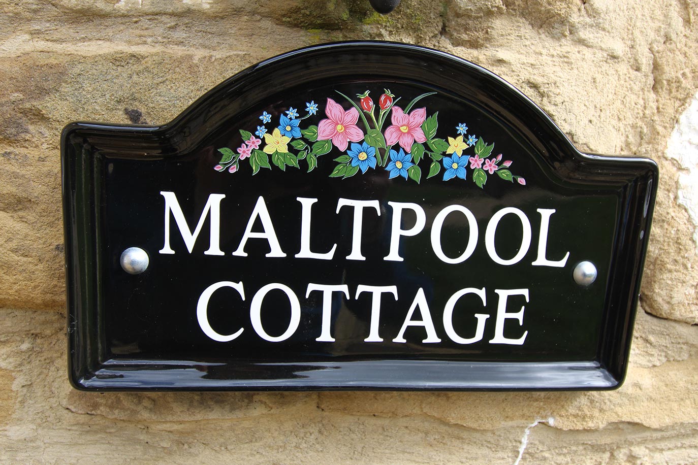 Maltpool Cottage exterior at Burradon Farm Houses & Cottages