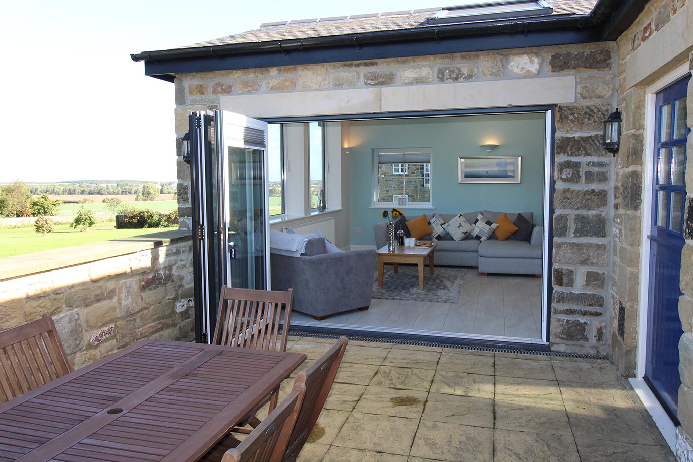 Wheatlands Cottage sunroom & patio area | Burradon Farm Houses & Cottages