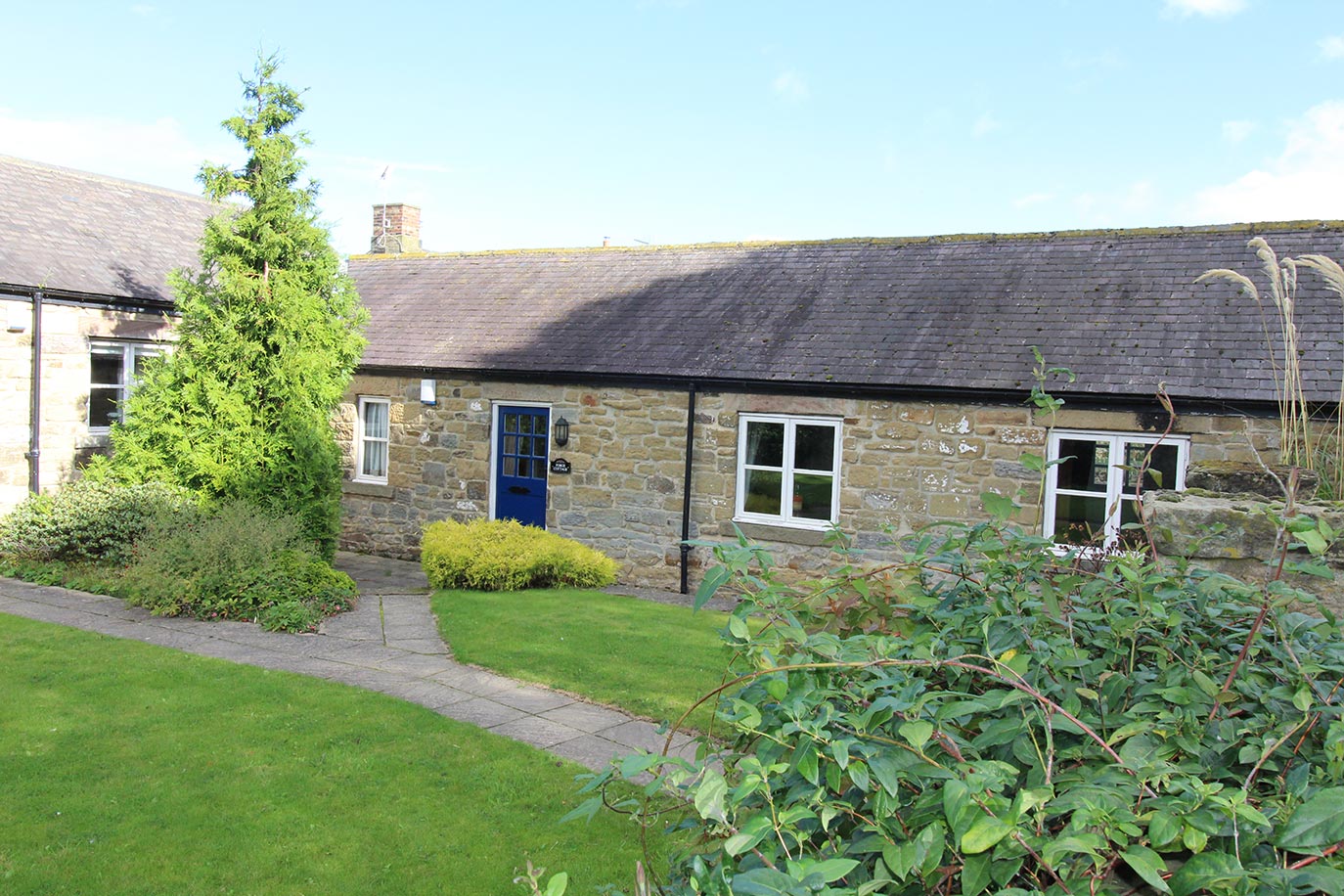 Forge Cottage front garden | Burradon Farm Houses & Cottages