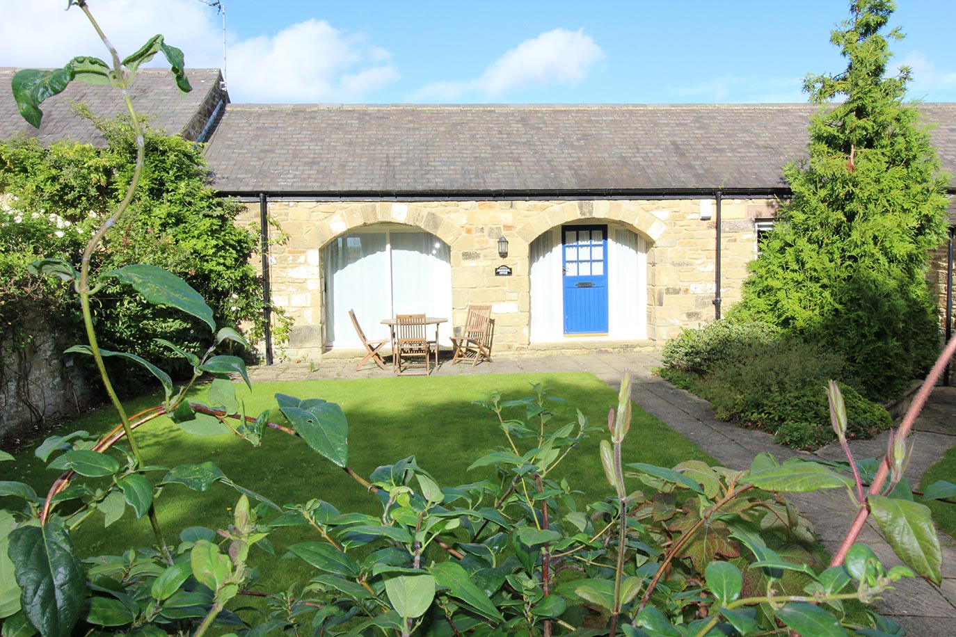 Honeysuckle Cottage front shared garden | Burradon Farm Houses & Cottages